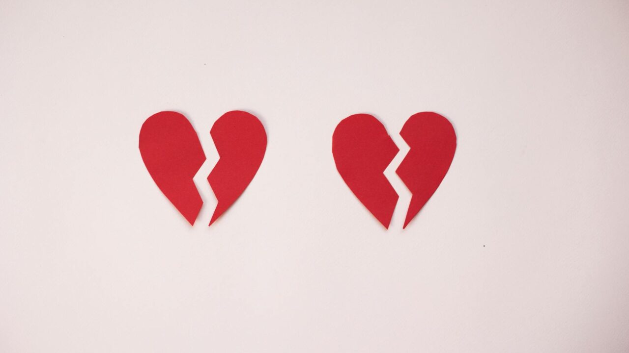 broken paper hearts on white background