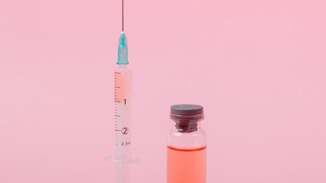 vaccine on pink surface