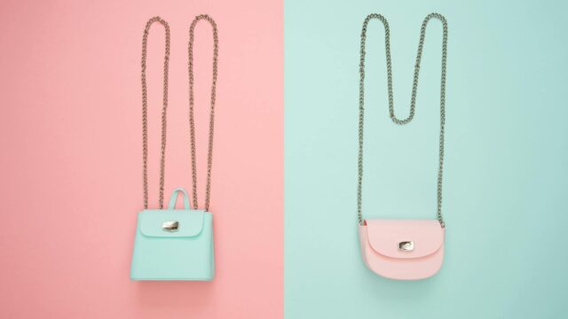 photo of two teal and pink leather crossbody bags